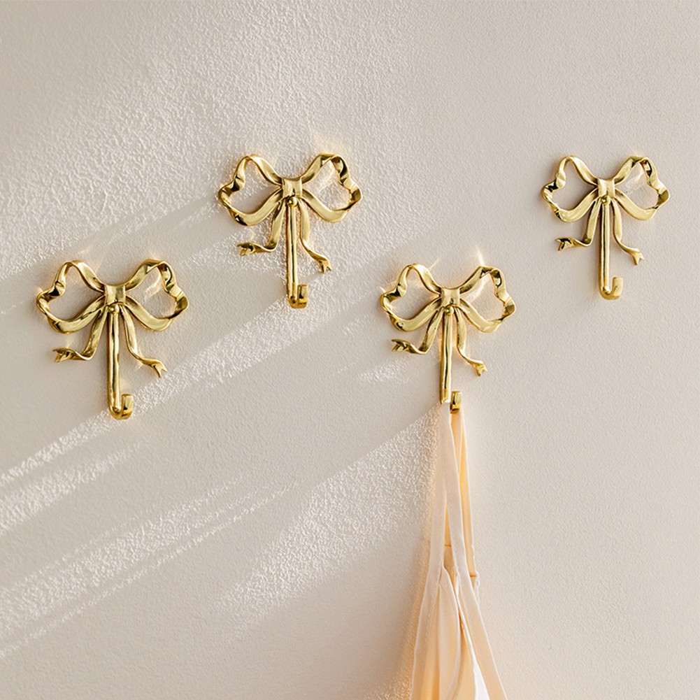 Platzsparende Gold Bogen Knoten Kleiderhaken Set mit Schrauben für vente en gros einfache Mon