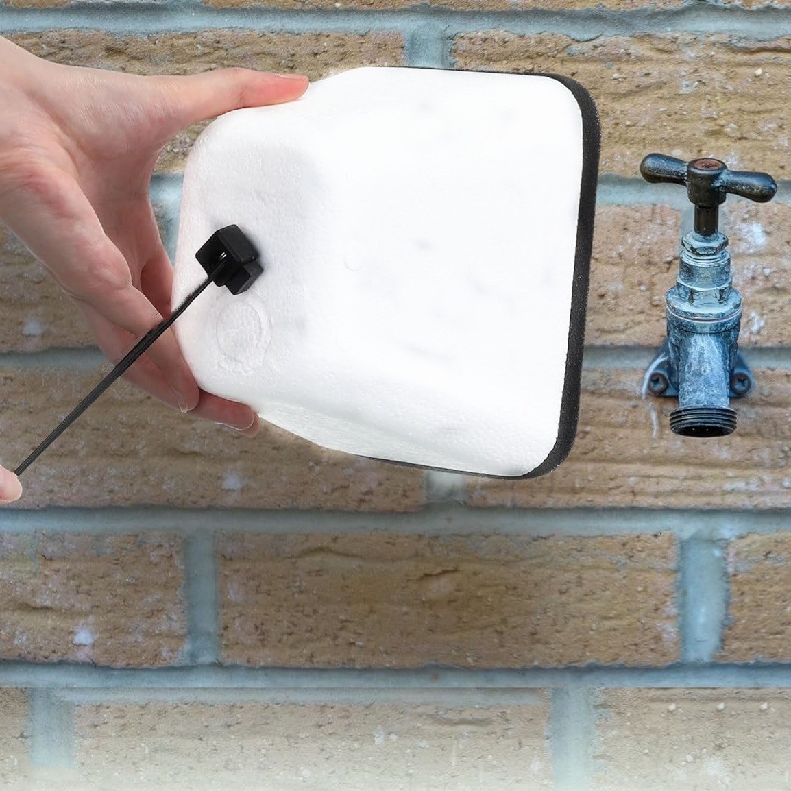 Protect Outdoor Faucet with Foam Cover for Winter Insulation and Freeze Safety